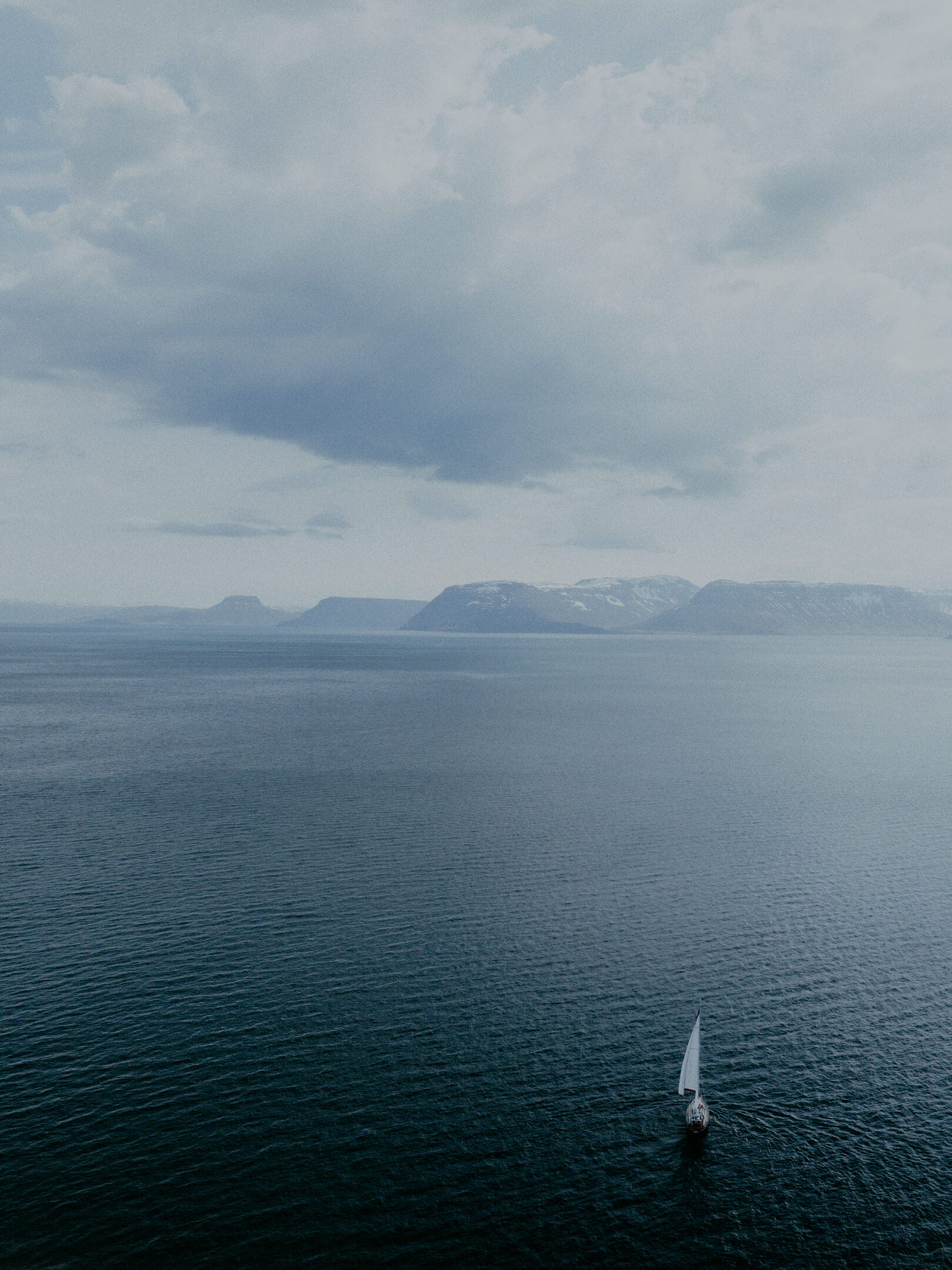 A sailboat in the Arctic Ocean off the coast of Iceland