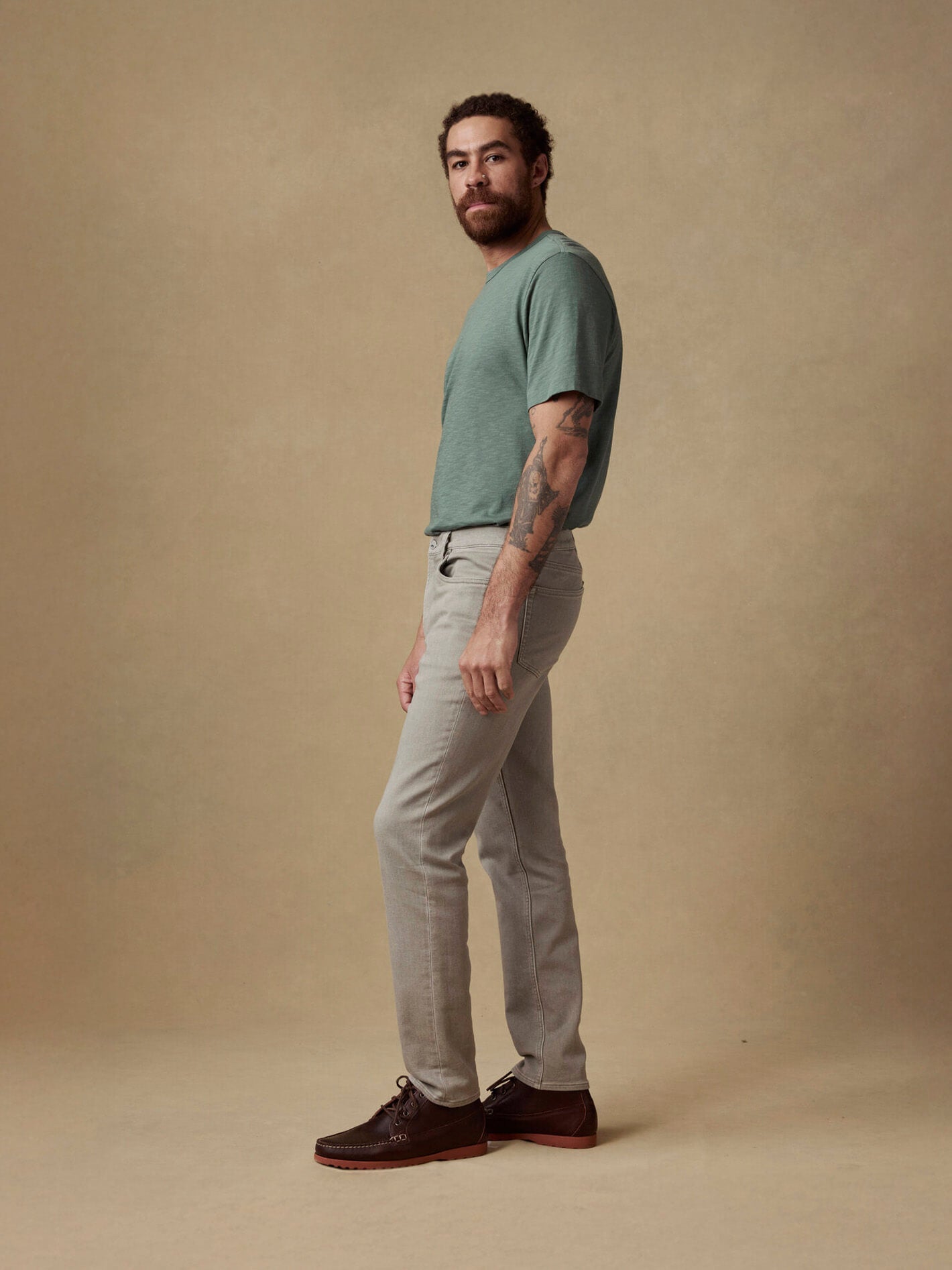 male model wearing stretch terry pants on a canvas backdrop