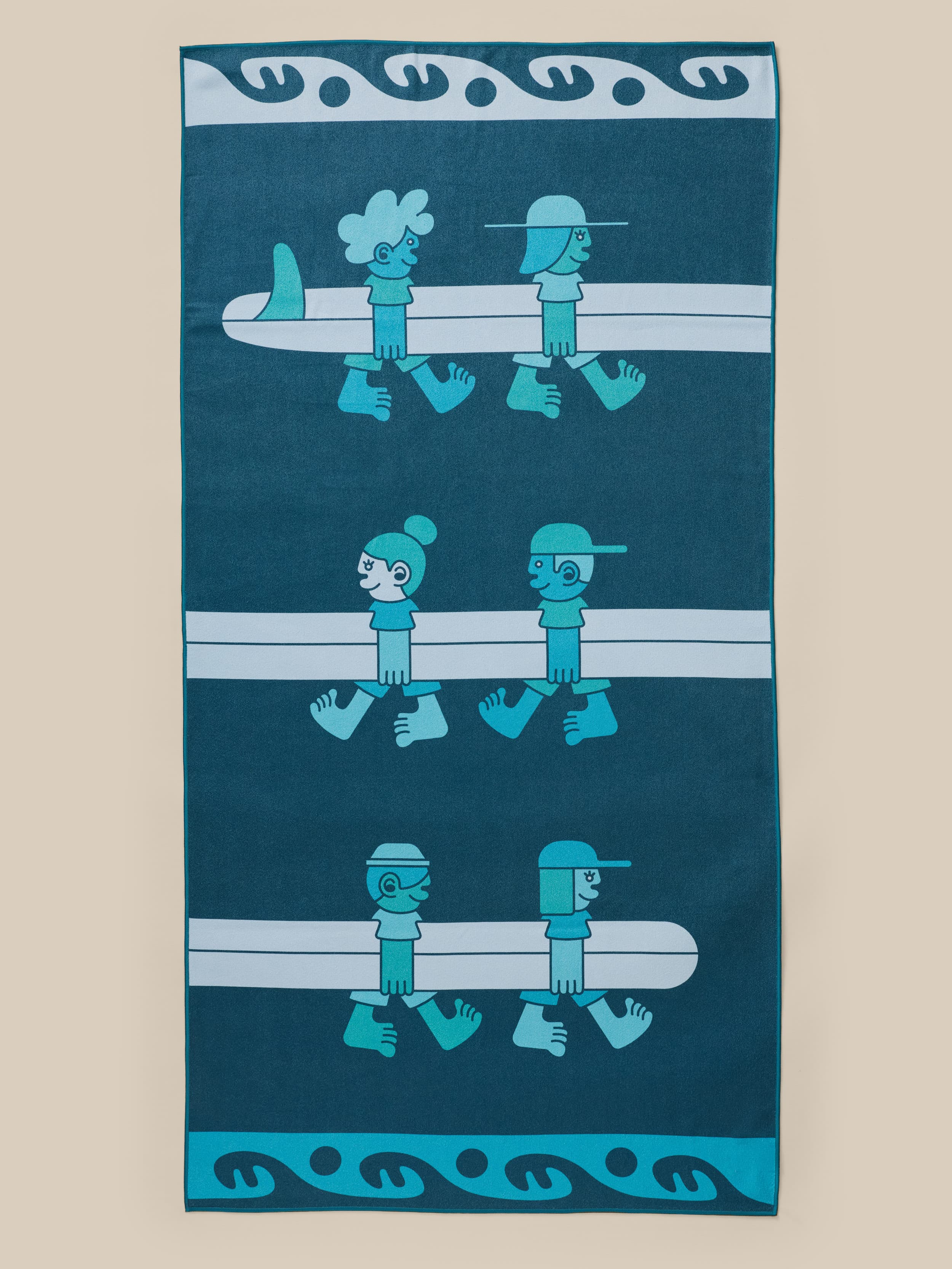 Faherty x Surfrider Foundation towel with surfboard graphic on the front against a beige background