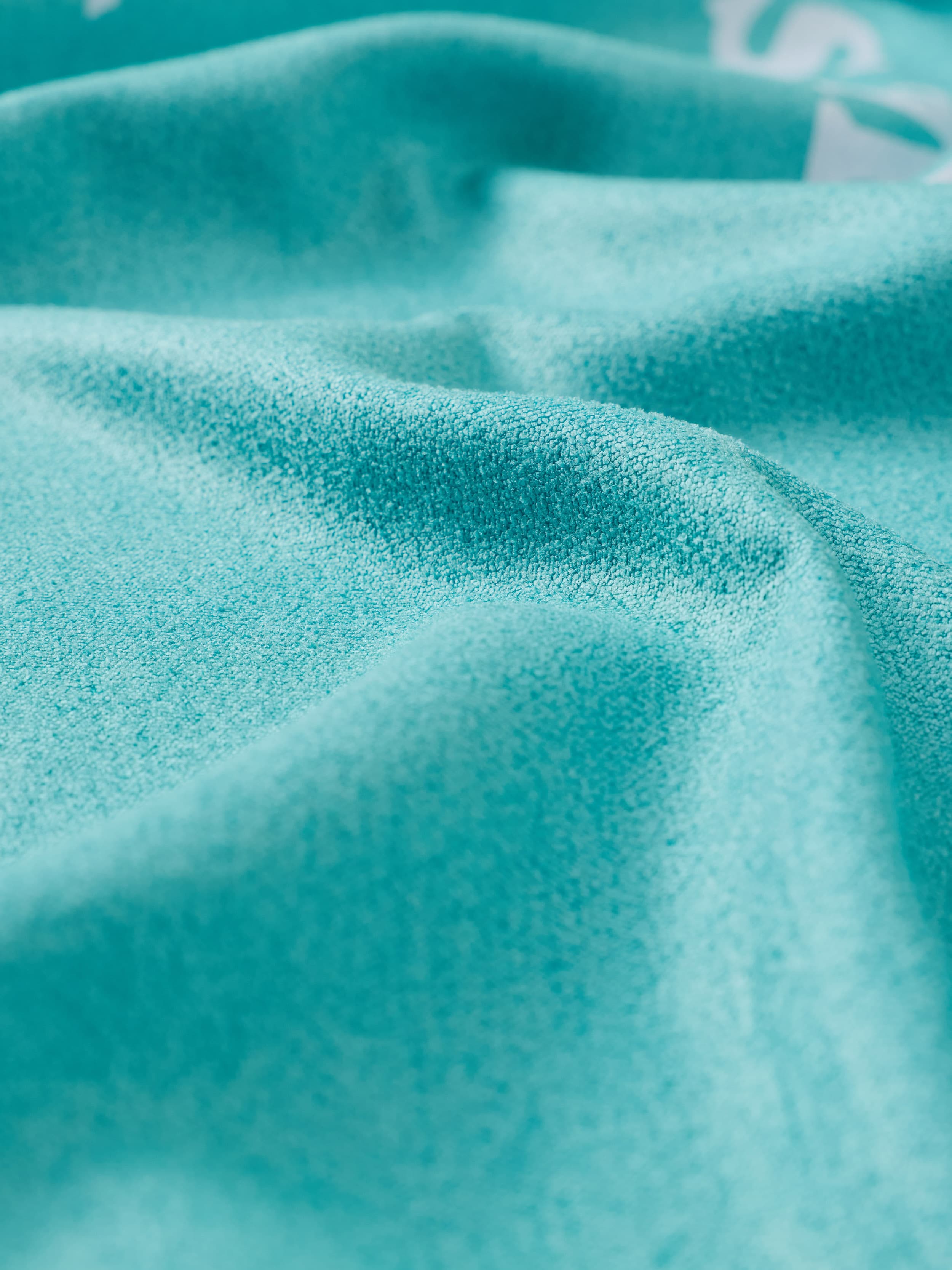 Close-up of textured turquoise towel