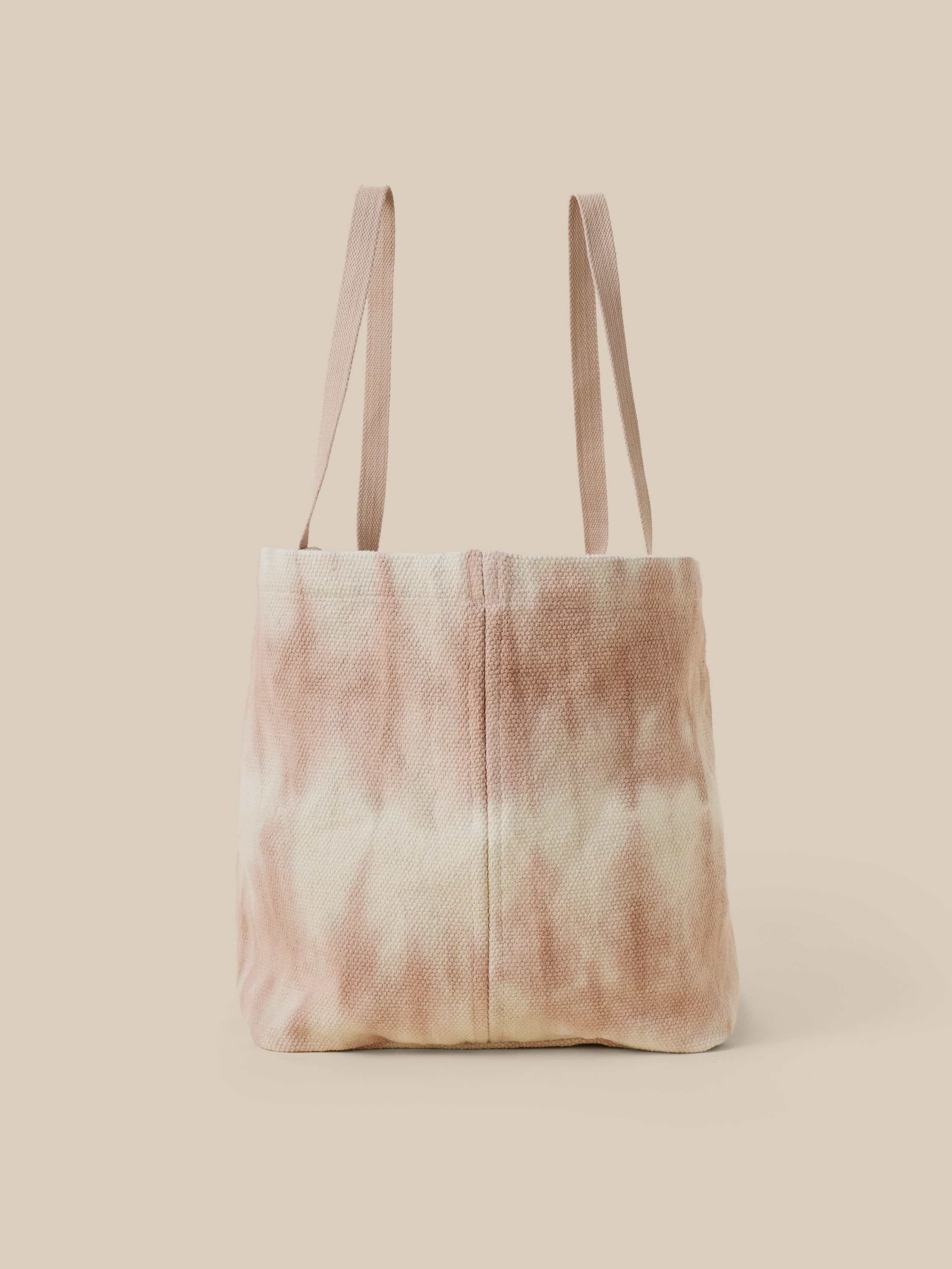 Tie-dye tote bag on a beige background
