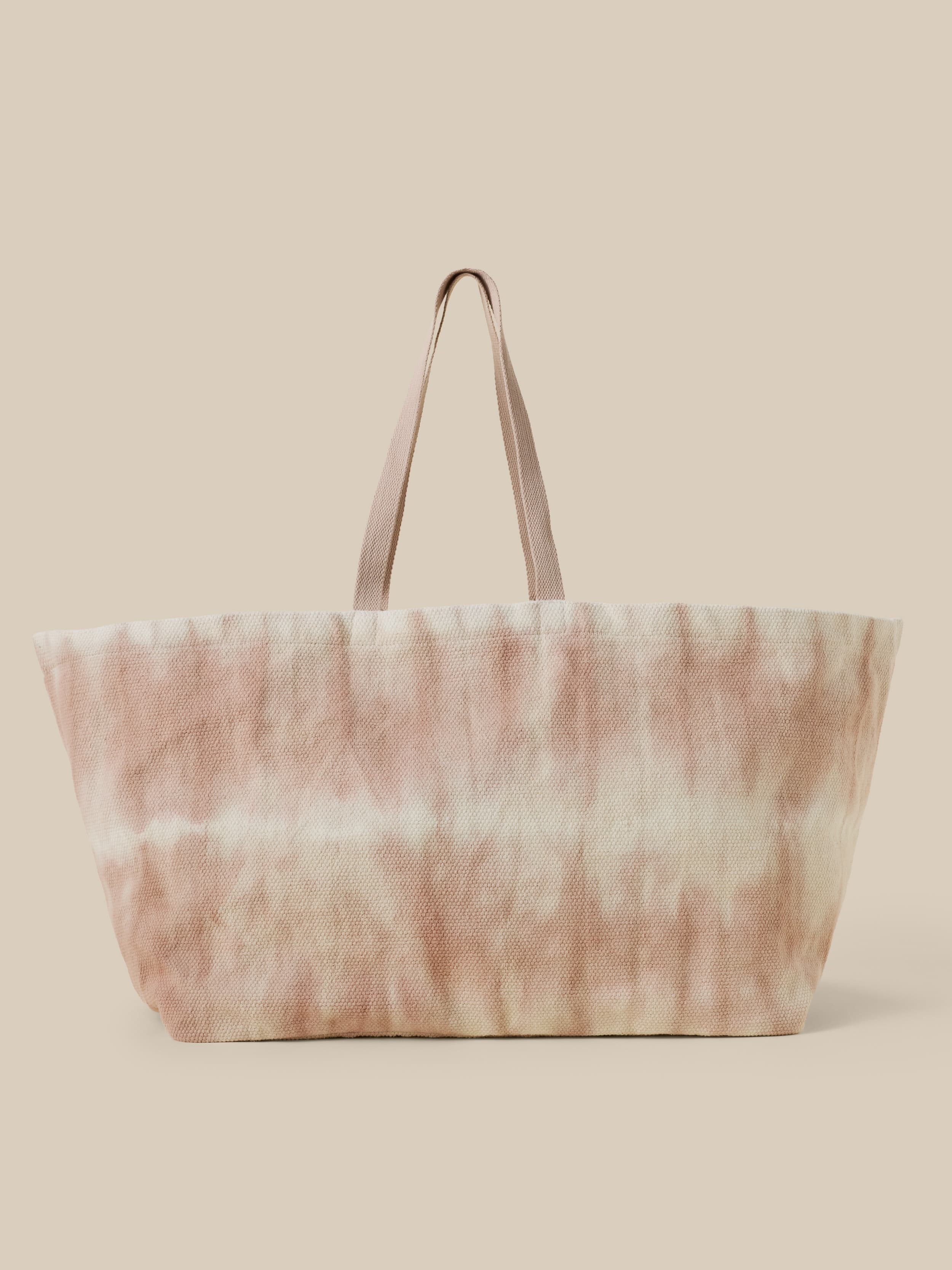 Tie-dye tote bag on a beige background