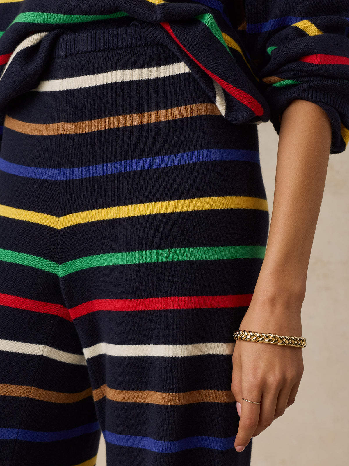 Close up of a woman wearing a striped set, image 4 of 6