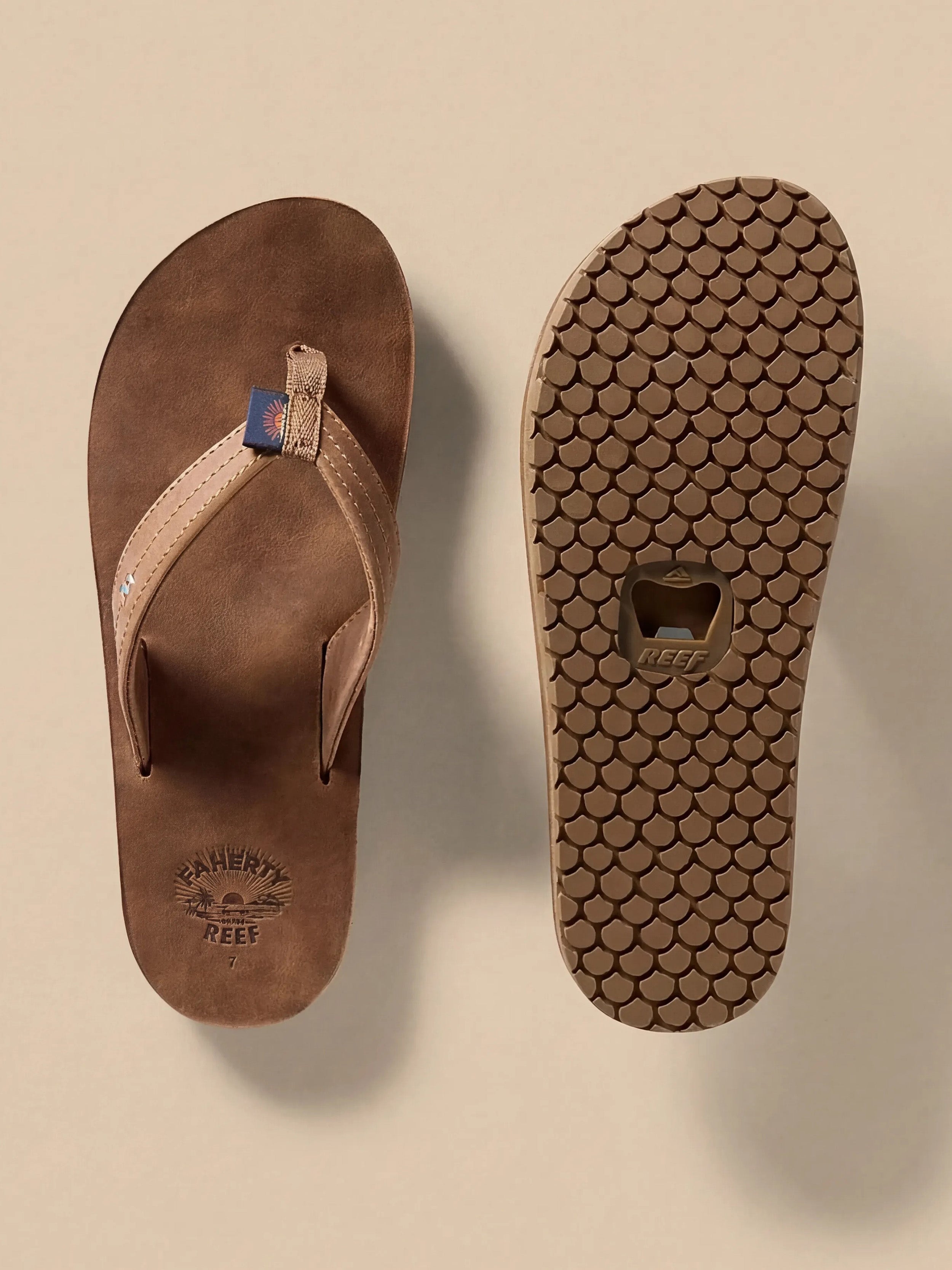 Brown flip-flop sandal with textured sole and bottle opener detail against a beige background