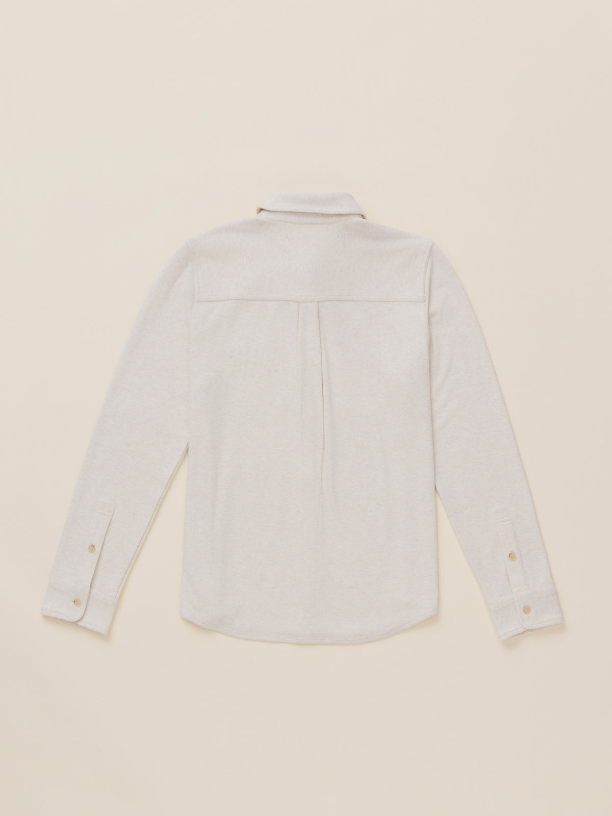 An off white long-sleeve button-up shirt shown from the back, laid flat on a matching light beige background., image 7 of 7