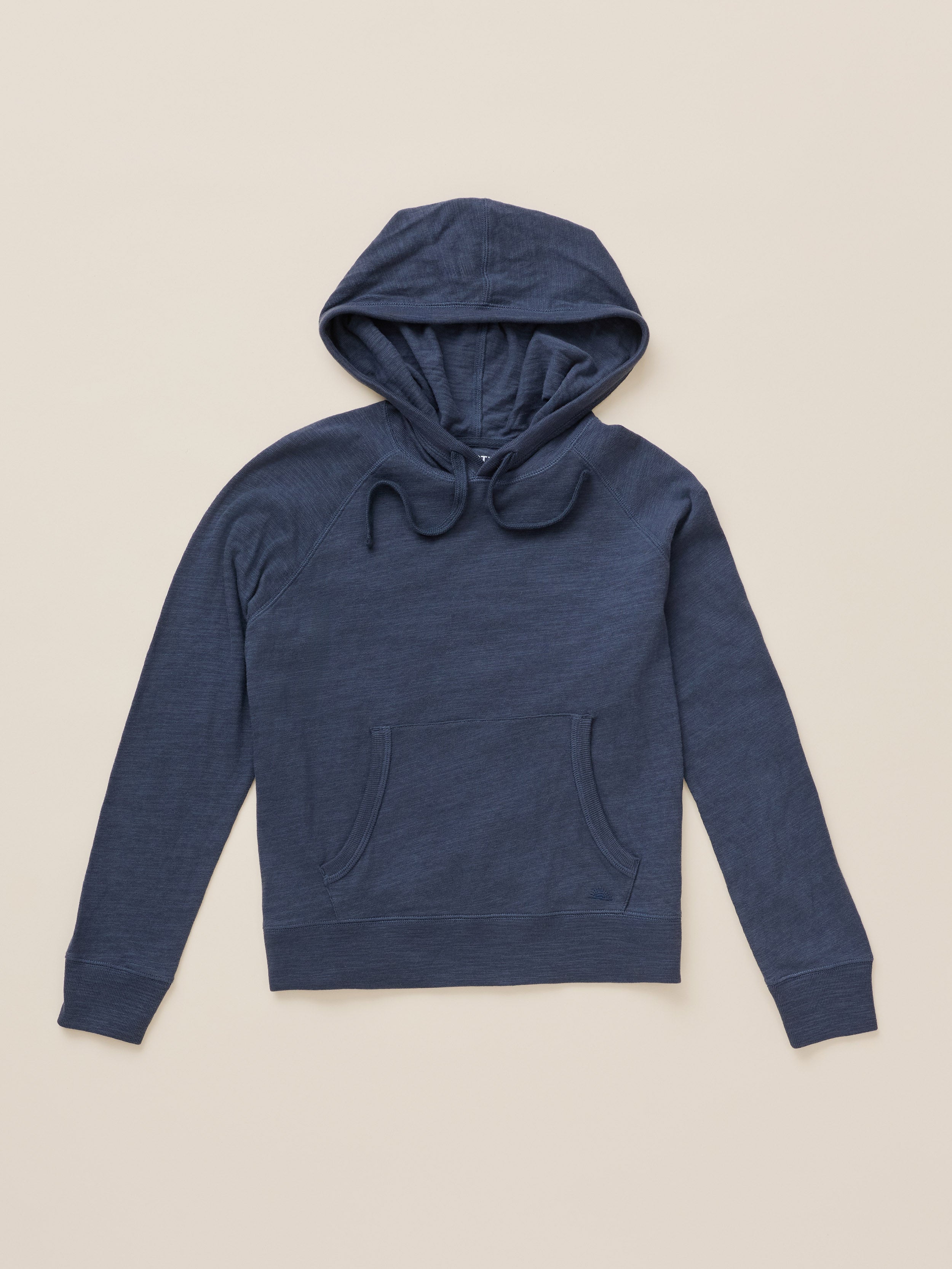 A navy blue long-sleeve hoodie with a drawstring hood and front kangaroo pockets, laid flat on a light beige background.