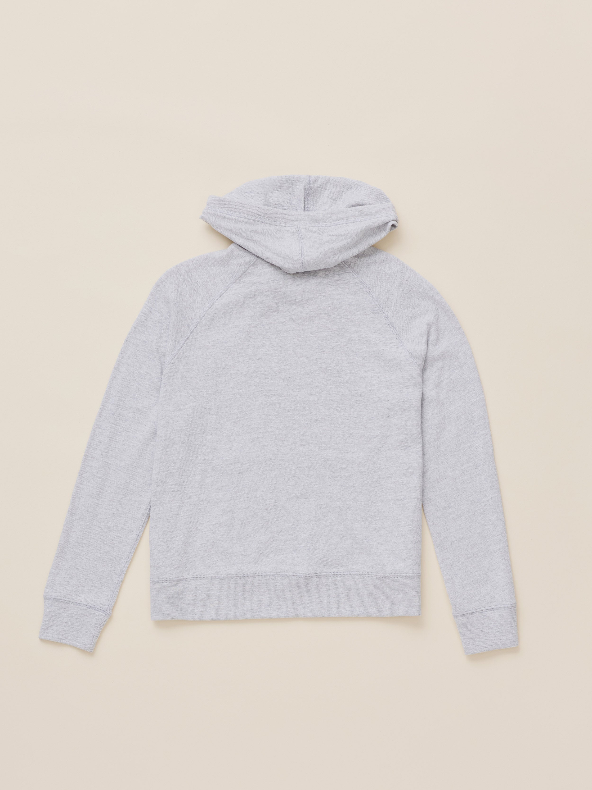 A light gray heathered hoodie shown from the back, laid flat on a solid beige background.