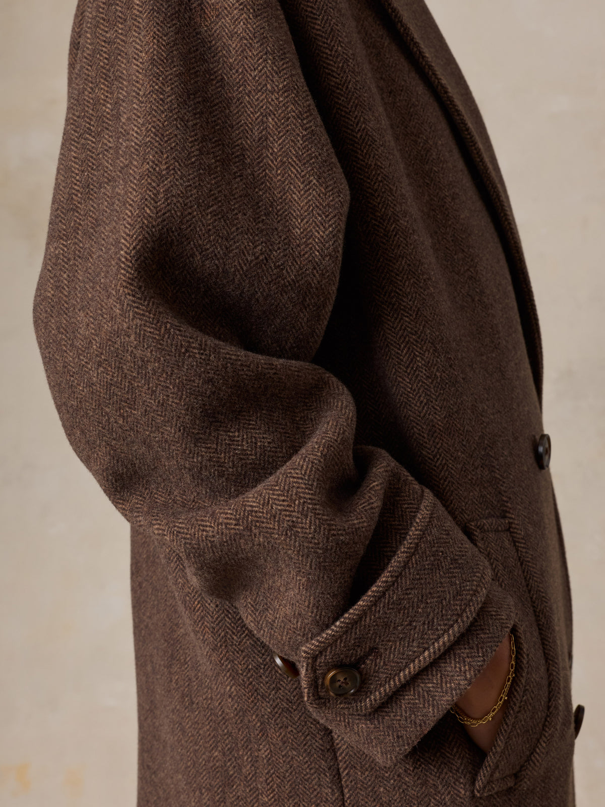 Close up of a woman wearing a brown coat, image 5 of 9