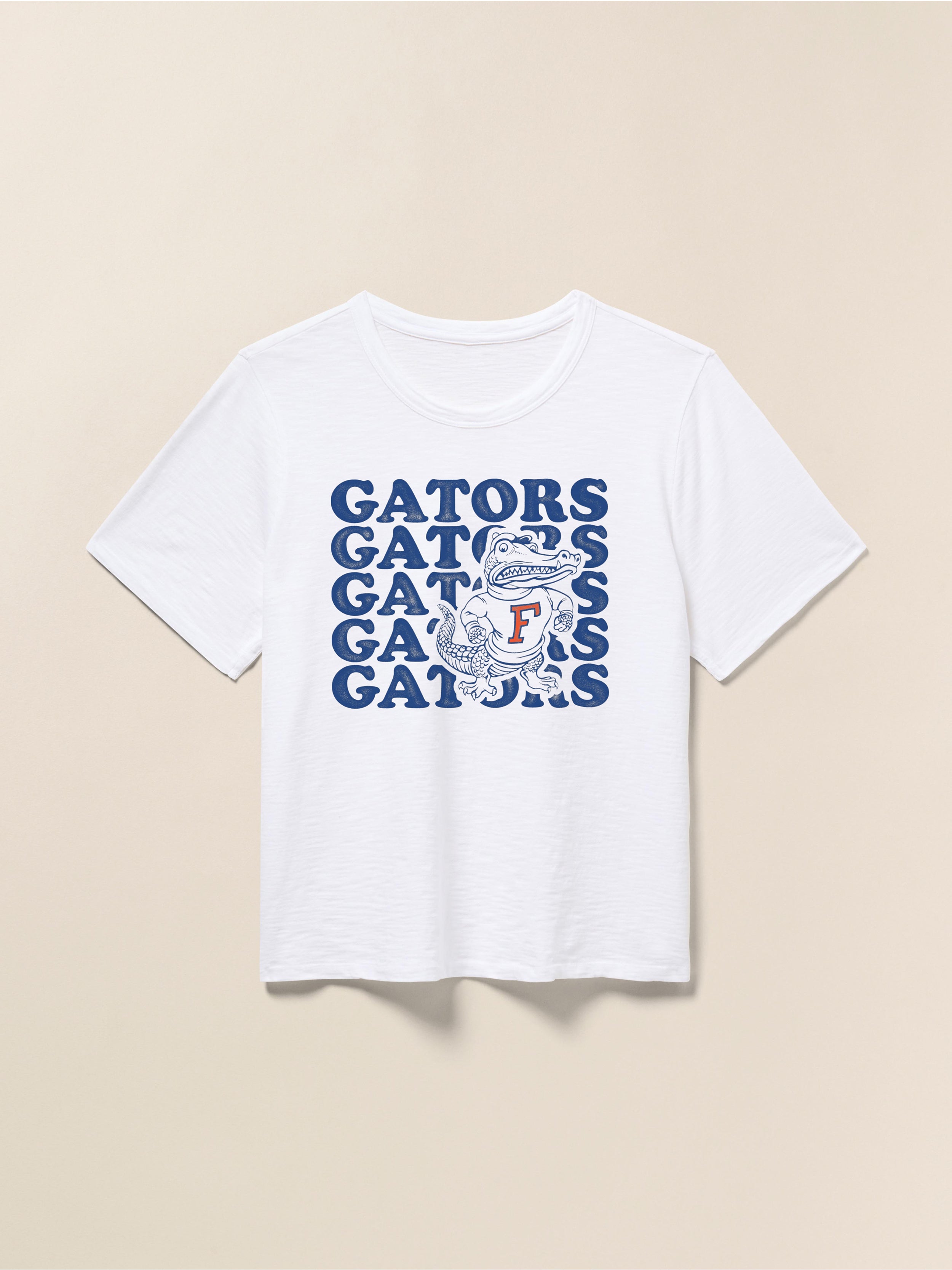 White t-shirt with blue Florida graphic against a beige background