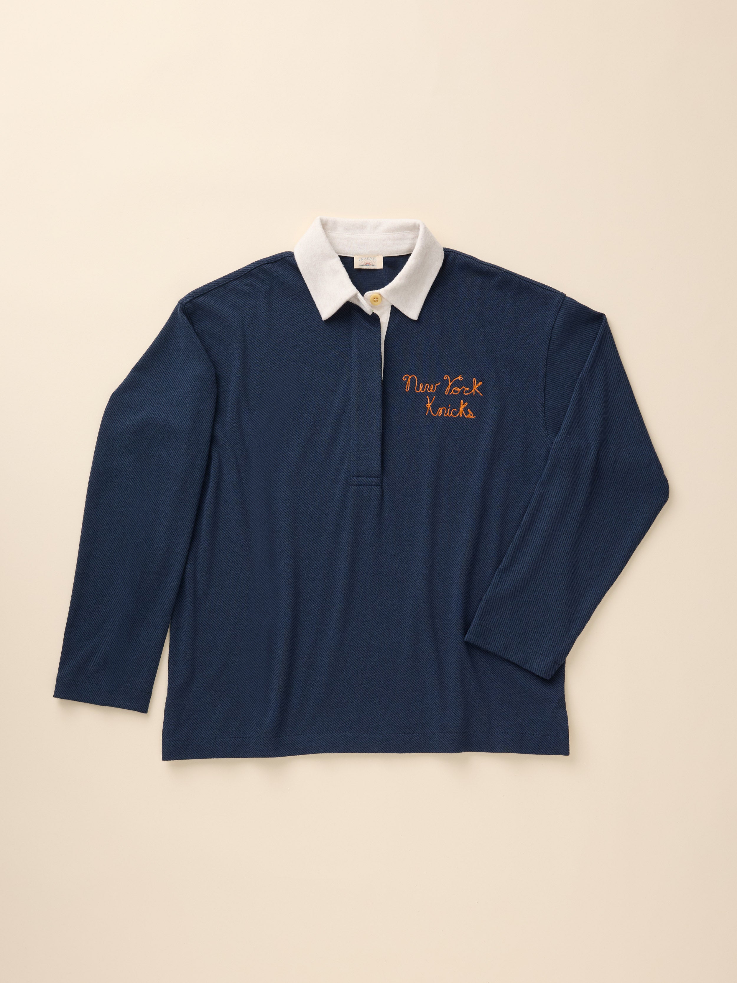 A navy blue NY Knicks rugby shirt