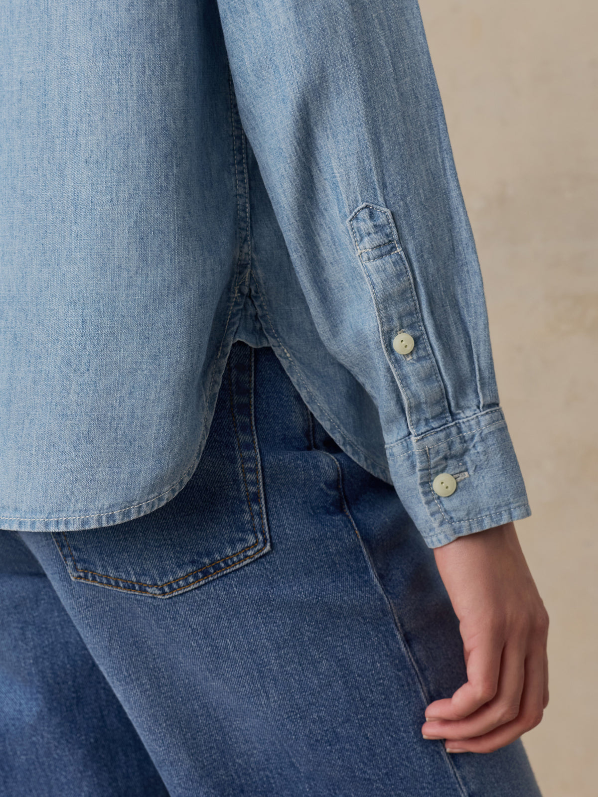 Close up of a woman wearing a LA Lakers chambray shirt, image 3 of 6