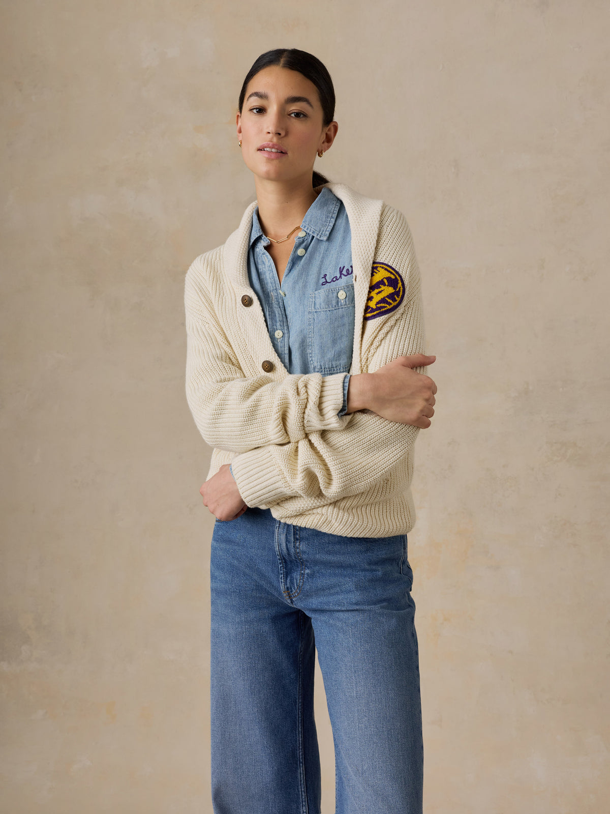 A woman wearing a LA Lakers chambray shirt and white cardigan, image 5 of 6