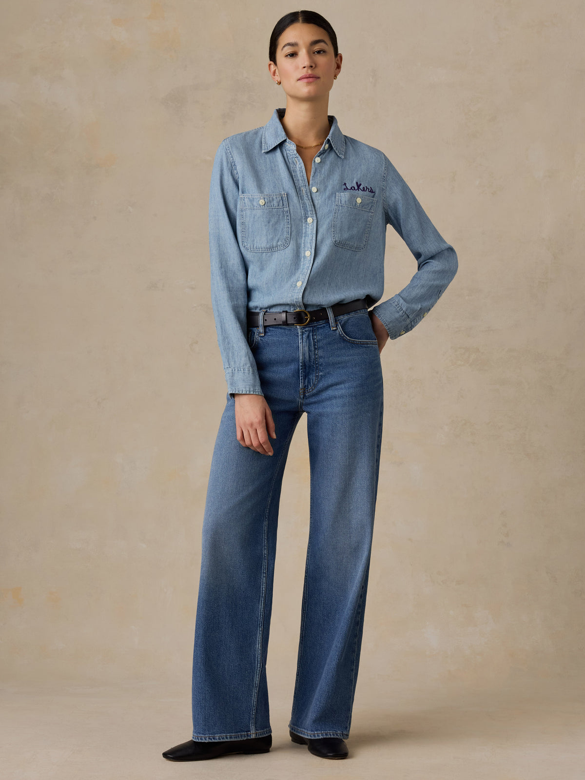 A woman wearing a LA Lakers chambray shirt and jeans, image 6 of 6