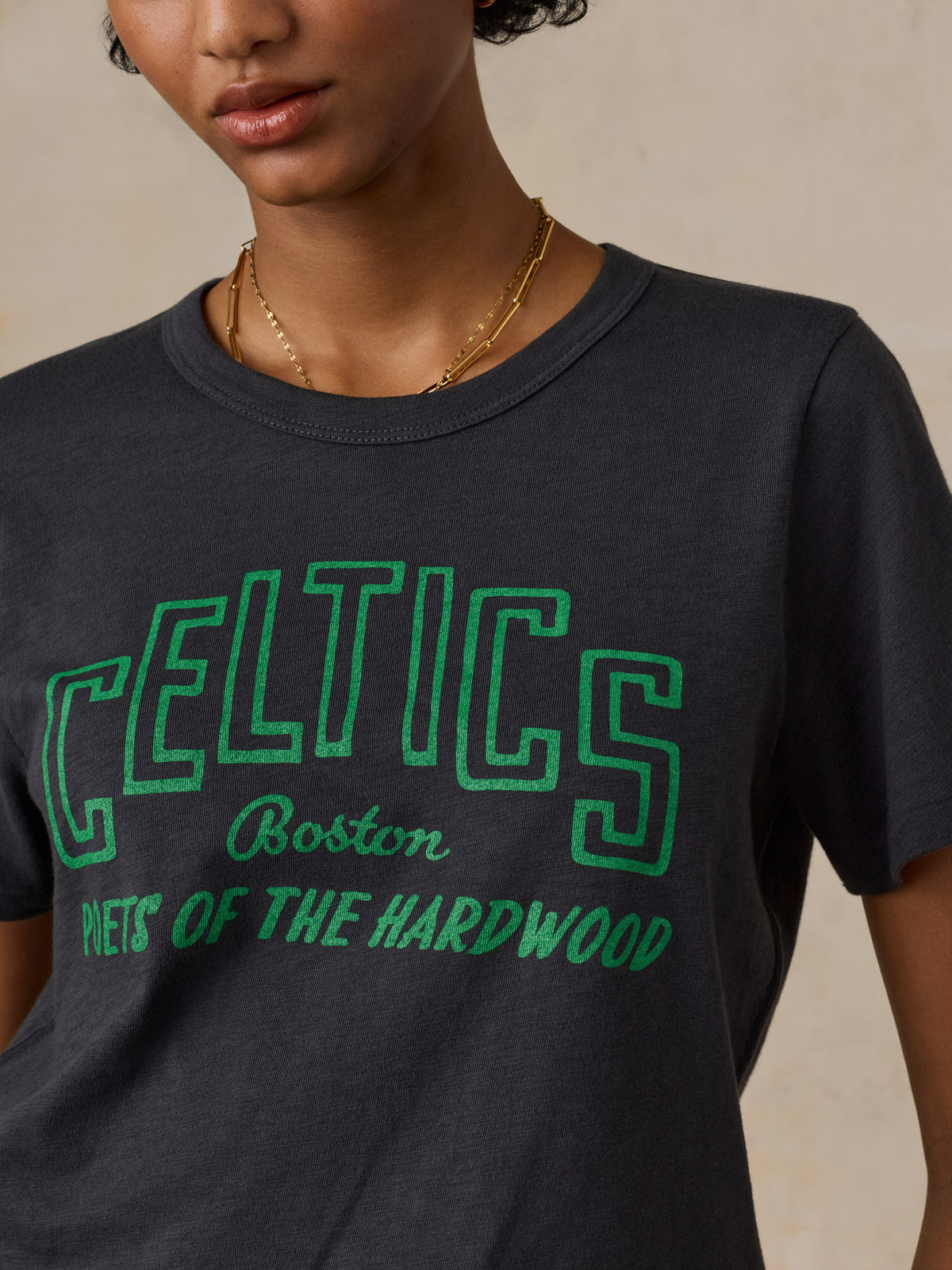 Close up of a woman wearing a black Boston Celtics tee, image 2 of 6