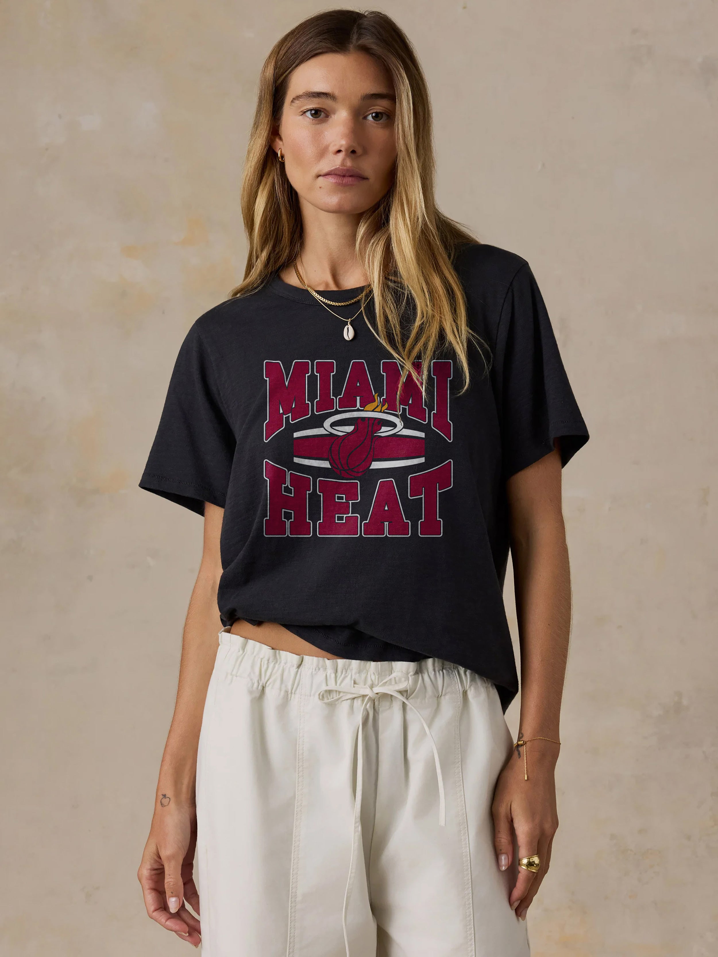 A woman wearing a black Miami Heat tee