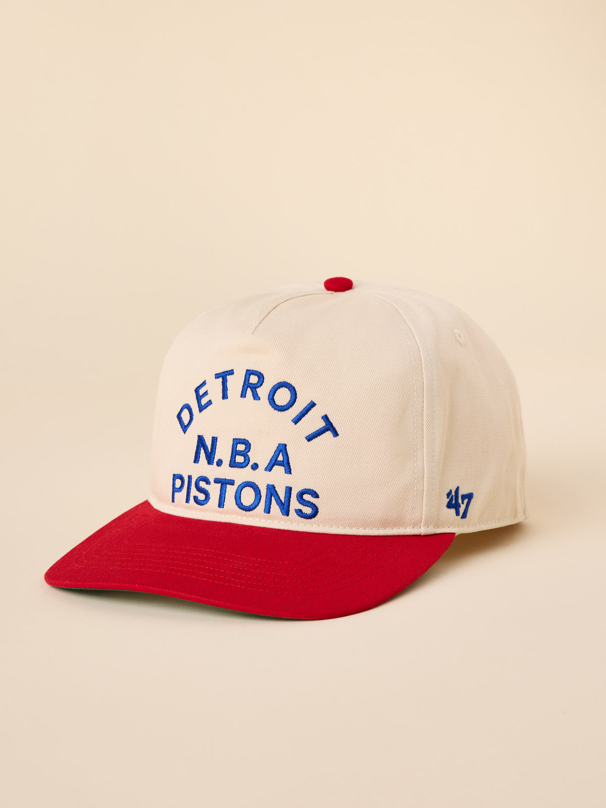 A beige and red Detroit Pistons hat, image 1 of 3
