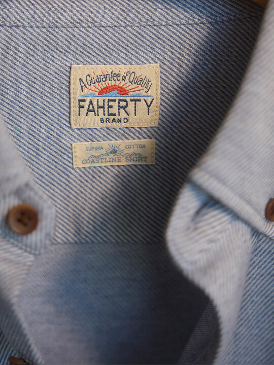 close up of coastline knit shirt label