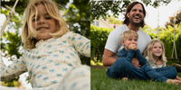 Kids and dad in pajamas outside.