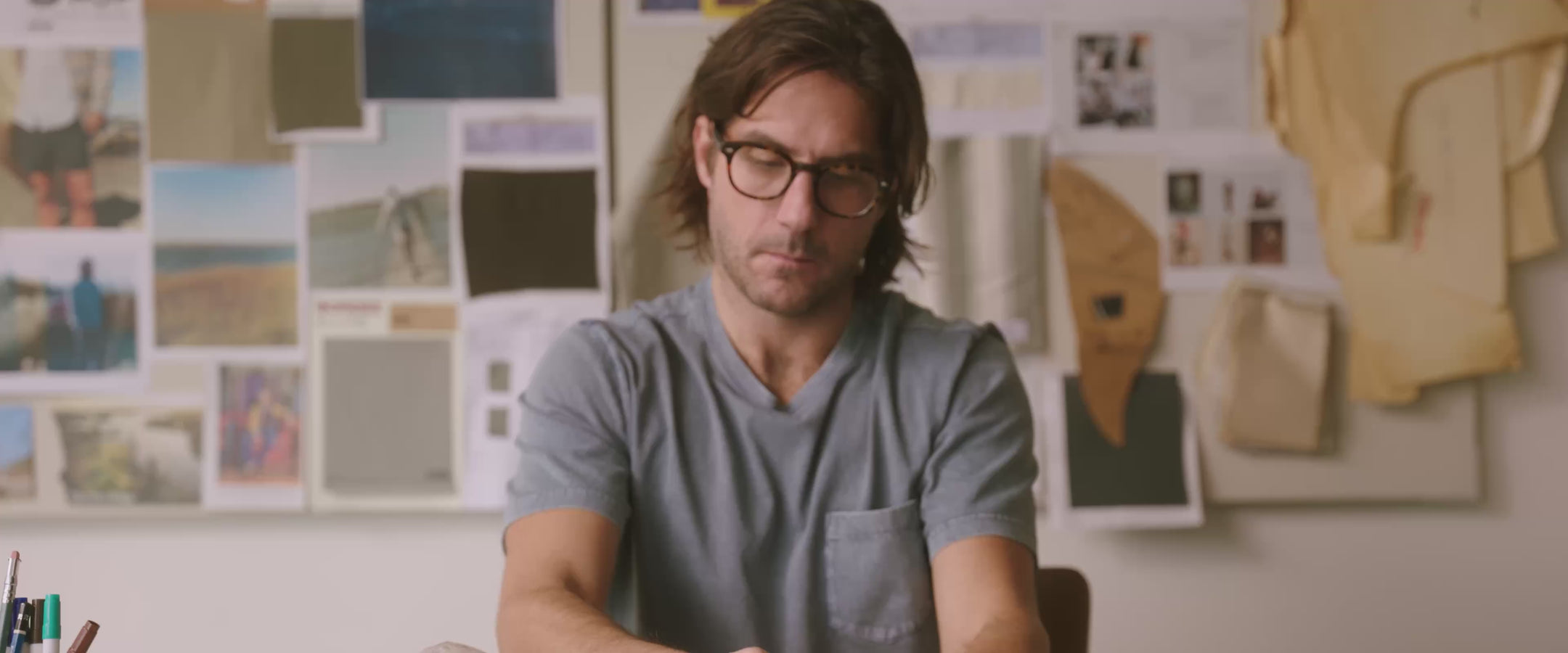 Mike Faherty working in the design studio: Sketching concepts, drawing patterns, cutting fabric and referencing lifestyle imagery. 