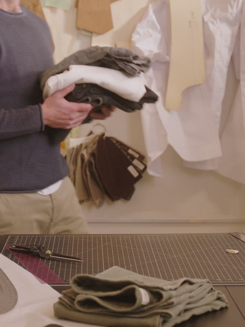 A video sequence of mike faherty designing the stretch terry pants: selecting fabric, creating a pattern, cutting and sewing.